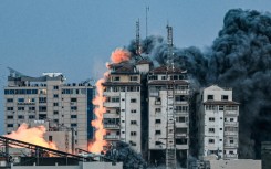 October 7, 2023: a ball of fire and smoke after an Israeli air strike hits the Palestine Tower in Gaza City