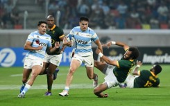 Argentina fly-half Tomas Albornoz (C) evades South Africa scrum-half Jaden Hendrikse in Santiago del Estero.