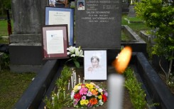 Flowers and candles at the gravesite of slain journalist Lasantha Wickrematunge on the 12th  anniversary of his death in 2021 