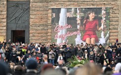 People attend the funeral of Giulia Cecchettin, a university student killed by her ex-boyfriend