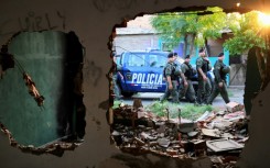 Members of Argentina's gendarmerie patrol the neighborhood of Los Pumitas, in the north of Rosario, Argentina on March 8, 2023