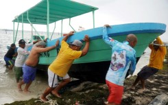 People secure their boats ahead of the arrival of Hurricane Helene in Cancun, Quintana Roo state, Mexico 