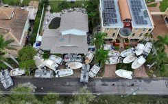 Boats are stacked up in front of homes after Hurricane Helene hit the area as it passed offshore on September 28, 2024 in Treasure Island, Florida