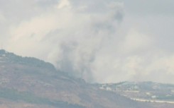 Columns of smoke rise over both sides of the Israel-Lebanon border