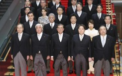 Images taken by local media showed what appeared to be an untidy patch of white shirt under the morning suits of Prime Minister Shigeru Ishiba and Defence Minister Gen Nakatani