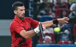 Serbia’s Novak Djokovic hits a return to Czech Republic’s Jakub Mensik during their men's singles match at the Shanghai Masters tennis tournament in Shanghai 