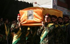 Hezbollah fighters carry the coffin of Mohammed Srur, head of the movement's drone unit, killed on September 26, 2024 in an Israeli strike on Beirut's southern suburbs