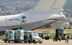 Aid provided for Lebanon by Saudi Arabia is unloaded on the tarmac at Beirut International Airport