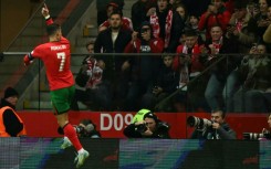 On target again: Cristiano Ronaldo celebrates scoring Portugal's second goal against Poland