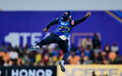 Sri Lanka's captain Charith Asalanka tries to stop the ball during the second T20 against the West Indies