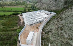 The processing centres are surrounded by high walls and security cameras 