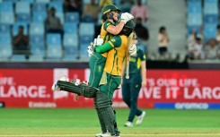 Anneke Bosch (L) leaps into the arms of  Chloe Tryon to celebrate South Africa's eight wicket win over Australia in the semi-final of the Women's T20 World Cup 