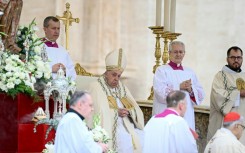 Pope Francis (C) presided over the canonisation ceremony in Saint Peter's Square in the presence of thousands of Catholic faithful from around the world