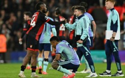 Ten-man Arsenal suffered a shock defeat at Bournemouth