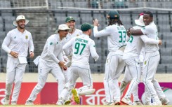 South Africa's Kagiso Rabada celebrates with teammates after taking a wicket