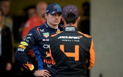 Red Bull Racing's Dutch driver Max Verstappen (L) talks with McLaren's British driver Lando Norris after qualifying for the Mexico Grand Prix