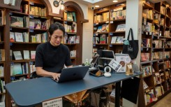 Rokurou Yui working at his bookstore in Tokyo