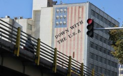 A large anti-US mural painted on the wall of a building in central Tehran