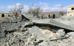 People check the damage a day after Israeli air strikes targeted the Lebanese village of Knaisseh near Baalbek in Lebanon's eastern Bekaa Valley