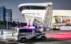 A police car is seen at the Zhuhai Sports Centre on November 12, 2024, a day after a car rammed through the site killing dozens 