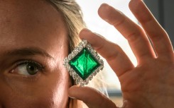 A Christie's employee poses with The Aga Khan Emerald