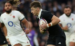 New Zealand fly-half Beauden Barrett (C) suffered concussion in the Nations Series win against England in Twickenham on November 2