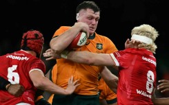 Australia prop Angus Bell is tackled by James Botham and  Aaron Wainwright 