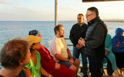 A picture released by the Egyptian State Information Service shows Red Sea governor Amr Hanafi speaking to survivors in Marsa Alam