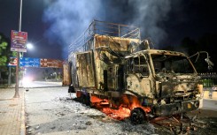 A rally truck used by Bushra Bibi, the wife of Pakistan's former prime minister Imran Khan, after being set ablaze in Islamabad at the height of the protests