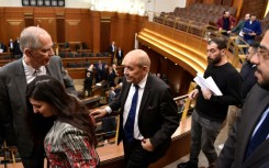 France's envoy to Lebanon Jean-Yves Le Drian (C) and France's ambassador to Lebanon Herve Magro (L), arrive for a parliamentary session at the Lebanese parliament in Beirut