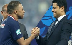 France star Kylian Mbappe (L) and Paris Saint-Germain president Nasser Al-Khelaïfi (R) after the team's French Cup final victory at Lyon on May 25, 2024