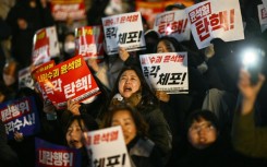 People take part in a protest calling for the resignation of South Korean President Yoon Suk Yeol in Seoul