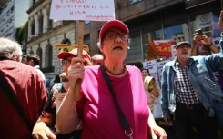 Alicia Ceresoli, an 80-year-old pensioner, protests outside the headquarters of PAMI, the agency that manages retiree benefits, in Buenos Aires on December 4, 2024