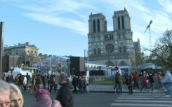 Onlookers flock to Notre-Dame Cathedral on eve of reopening