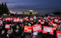 Protesters poured into the area around South Korea's National Assembly as lawmakers voted on a motion to impeach President Yoon Suk Yeol