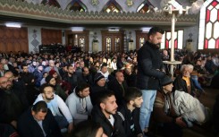 Syrian Muslims pray at a mosque in the northern city of Aleppo after its capture by Islamist-led rebels