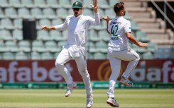 Dane Paterson (R) celebrates after the dismissing Sri Lanka's Dhananjaya de Silva 