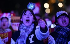 People take part in a protest calling for the ouster of South Korean President Yoon Suk Yeol outside the National Assembly in Seoul on Saturday