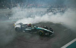 Final twist: Lewis Hamilton does a donut at the end of his last Mercedes rive at the Abu Dhabi Grand Prix