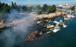 An aerial photo shows Syrian naval ships destroyed in an overnight attack on the port city of Latakia 