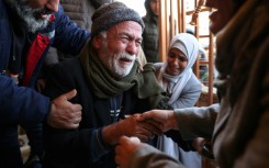 Grief-stricken relatives gather outside the Nasser Hospital in Khan Yunis following the latest Israeli air strikes on southern Gaza.