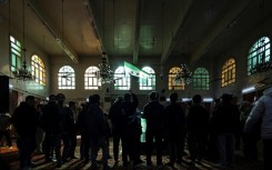 Mourners hold a funeral for Syrian activist Mazen al-Hamada