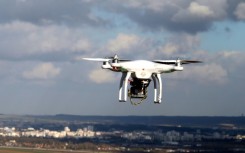 Drones, like the one pictured in this file image from 2015, are permitted for both business applications and recreational use, but are regulated Federal Aviation Administration rules