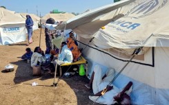 Sudanese who fled violence in Al-Jazira state rest at a camp for the displaced in the eastern city of Gedaref