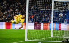 Marseille goalkeeper Geronimo Rulli watches Lille's leveller fly past him