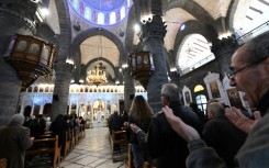 Worshippers attend Sunday Mass at the Cathedral of Our Lady of the Dormition, known also as the Olive Church, in Syria's capital Damascus