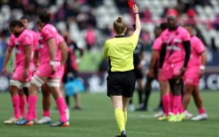 Scottish referee Hollie Davidson brandishes a red card at Sekou Macalou of Stade Francais