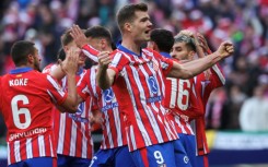 Atletico Madrid's Norwegian forward Alexander Sorloth (R) celebrates after scoring against Getafe