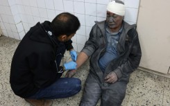 A wounded Palestinian man receives treatment at Al-Ahli Arab hospital in Gaza City, where the Civil Defence agency said an Israeli air strike killed four people