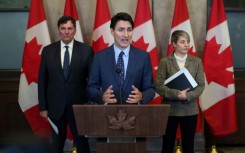 Canadian Prime Minister Justin Trudeau (C) faces a political crisis with the shock resignation of Chrystia Freeland as finance minister, a position that has been swiftly filled by Public Safety Minister Dominic LeBlanc (L)